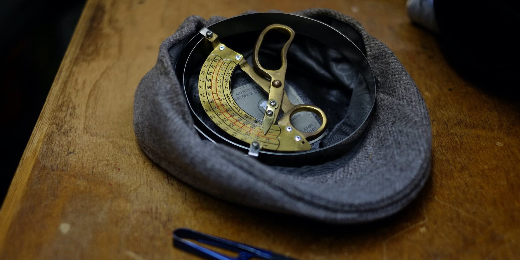 A Herdycountry flatcap being measured.